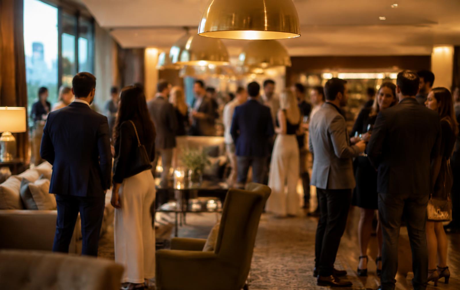 A private gathering of professionals in a warmly lit lounge